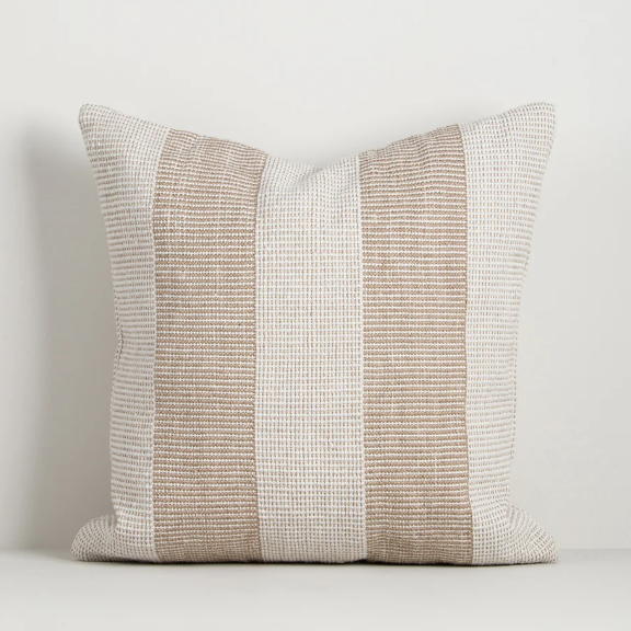 Shop the Baya Tide Outdoor Cushion at Comber and Comber. Handwoven from recycled PET with a textured linear design. Available in multiple colours.