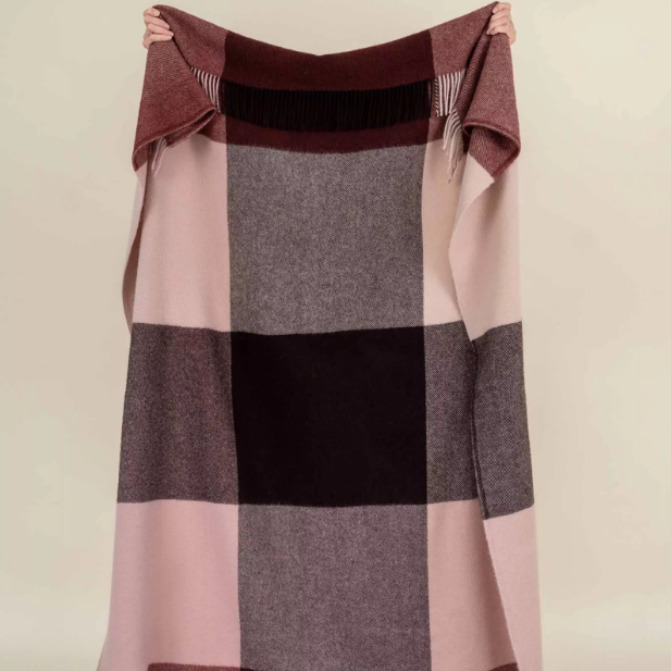 Shop the Brookside wool throw 140x240cm – a thick, 100% wool throw in a modern beetroot, chocolate, and soft pink large check design, perfect for warmth, style, and gift-giving.