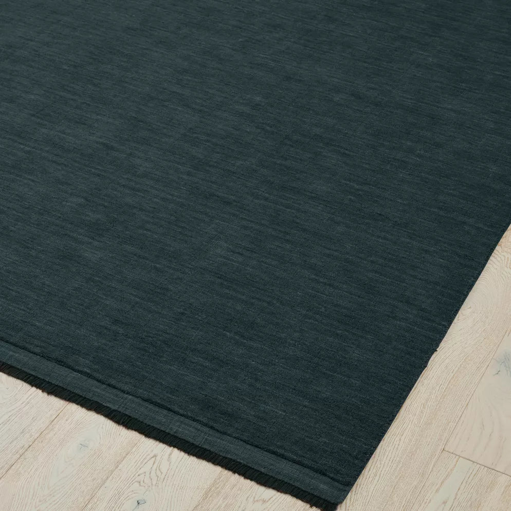 Deep Blue rug on a light wood floor. 2x3m 3x4m. 100% NZ wool