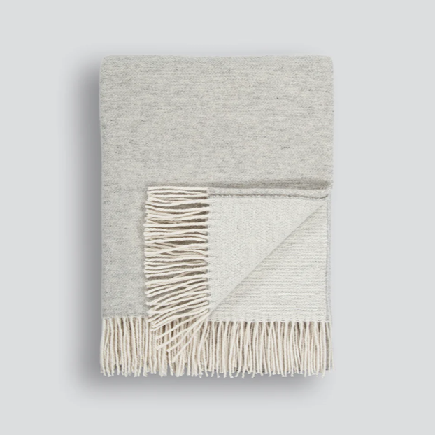 Elegant charcoal Casa Throw with natural-toned tassels
