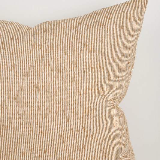 A beautifully textured cotton cushion featuring a subtle pinstripe weave and earthy colour palette, designed to bring warmth, depth, and effortless layering to contemporary interiors.