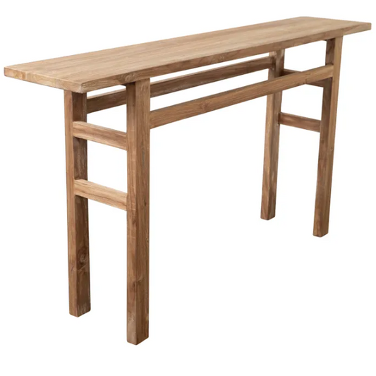 Small reclaimed teak console table in entranceway setting