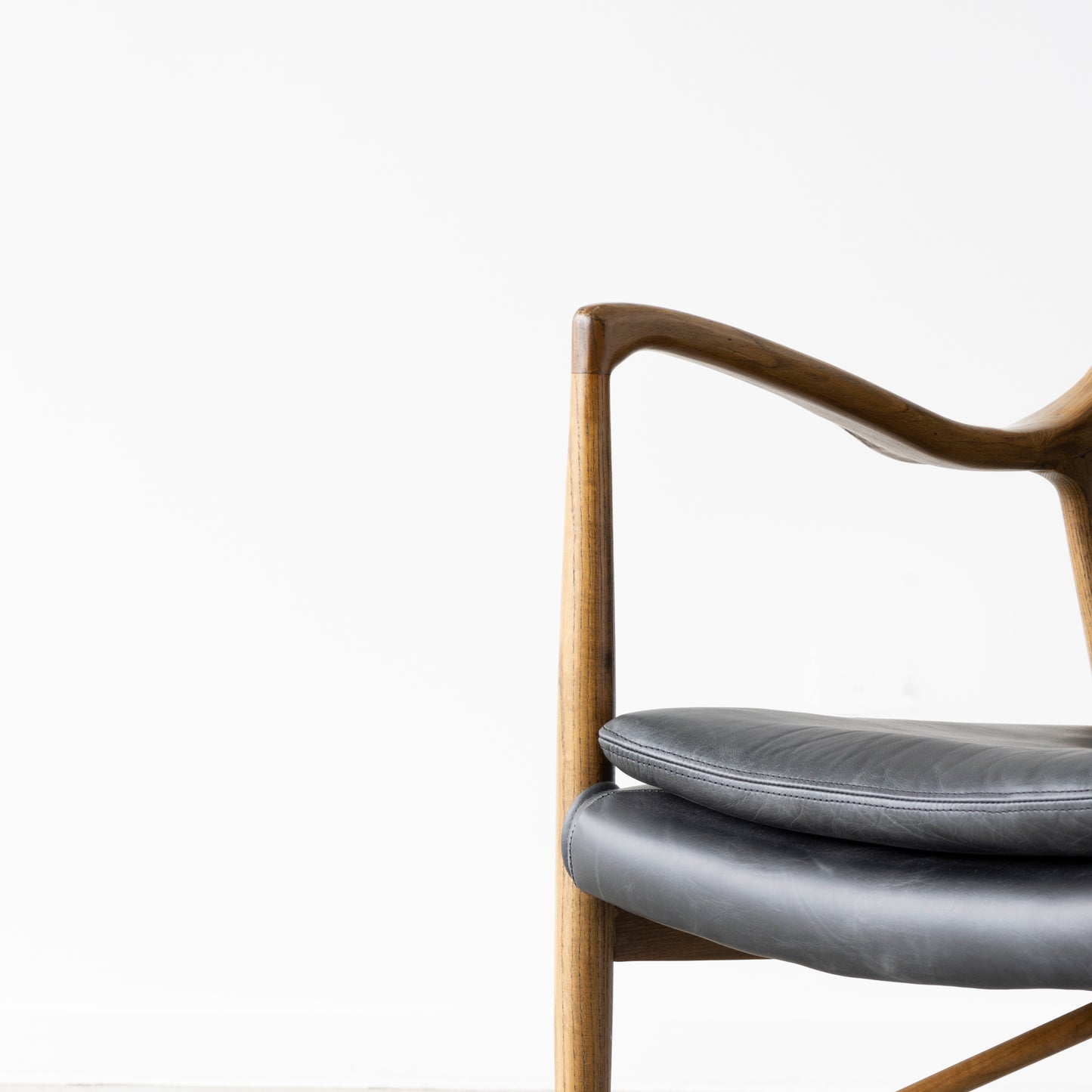 Solid ash chair featuring top-grade aniline hide