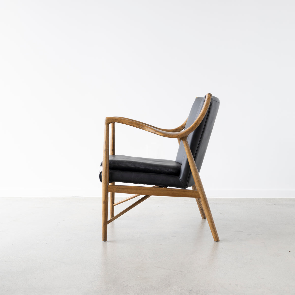 Contemporary ash frame chair with premium leather upholstery