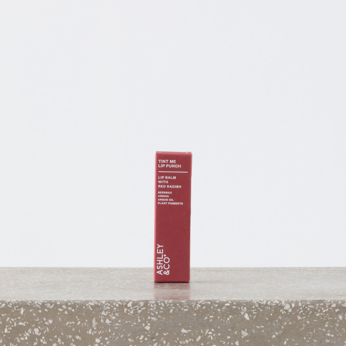 Tint Me Lip Punch red radish tinted balm in tube