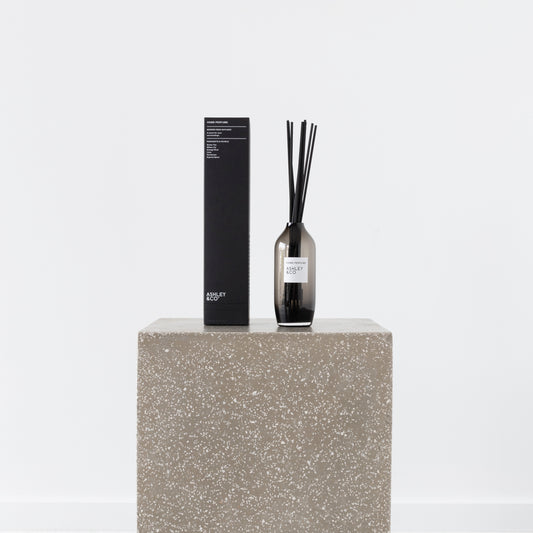 Close-up of Green Tea Home Perfume bottle and reed sticks