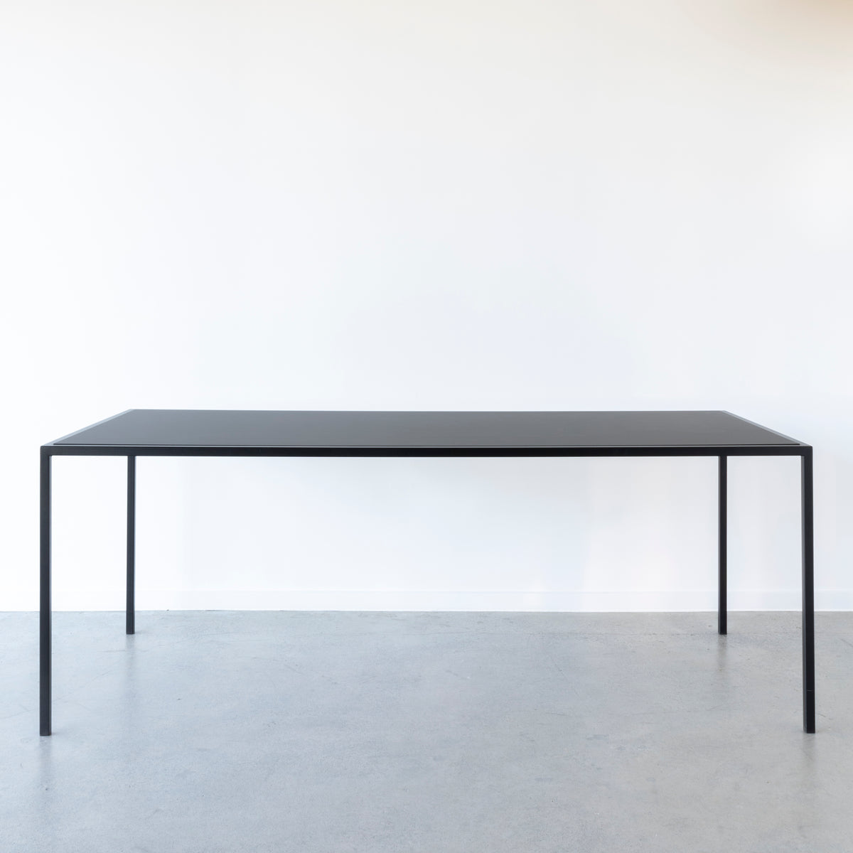 Nero Range dining table with reversible black and walnut top