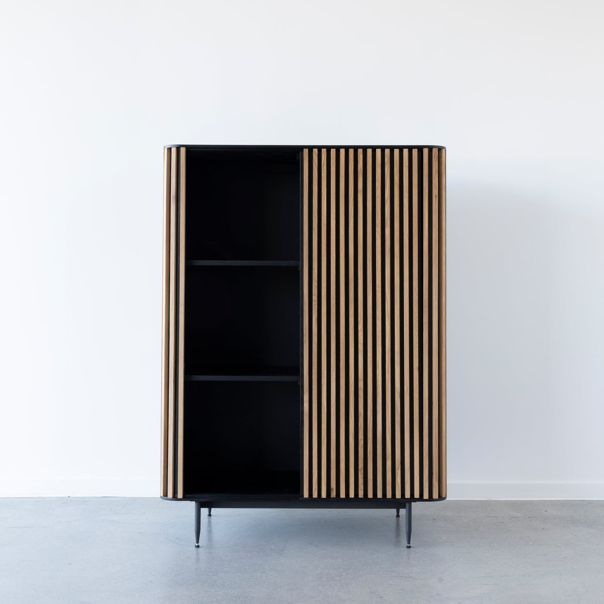 Contemporary oak strip highboard with sliding doors and black interior