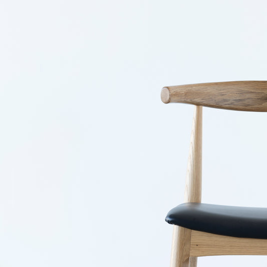 Contemporary oak barstool with curved back design