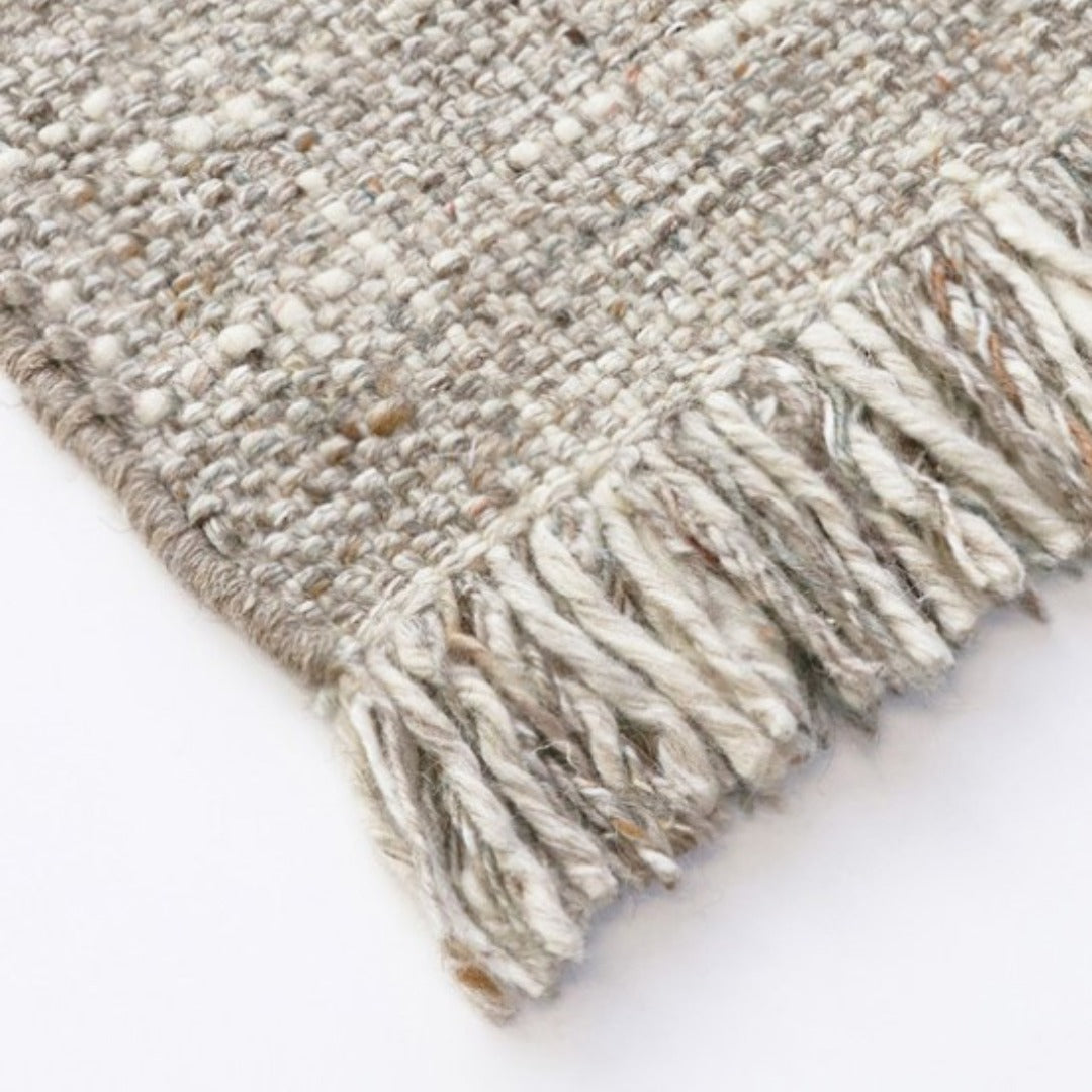 Tonal plaid floor rug with fringed edges