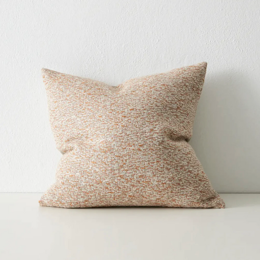 Artisanal woven cushion for indoor living spaces