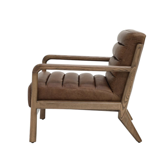 A relaxed, retro-inspired armchair with a low timber frame and soft leather cushions, designed for laid-back comfort.