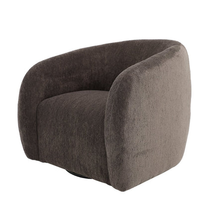 A sculptural swivel chair with deep comfort, tailored curves, and a timeless, versatile design.