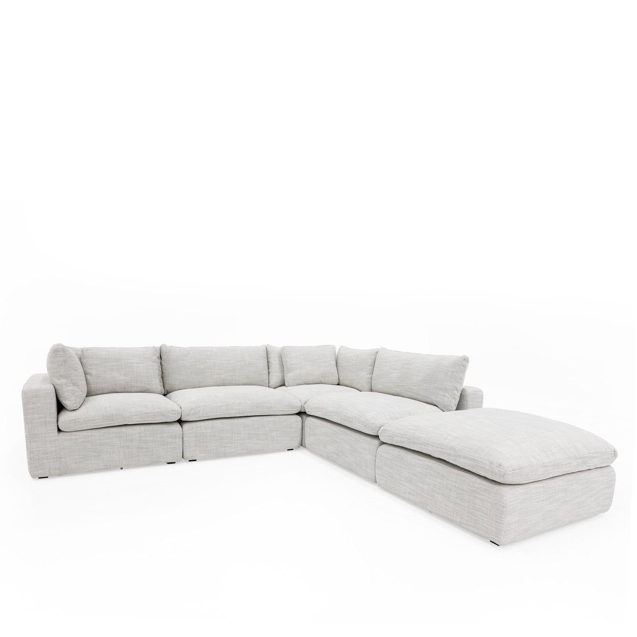 A luxurious modular sofa designed for cloud-like comfort, featuring deep seating, feather-filled cushions, and a flexible five-piece configuration.