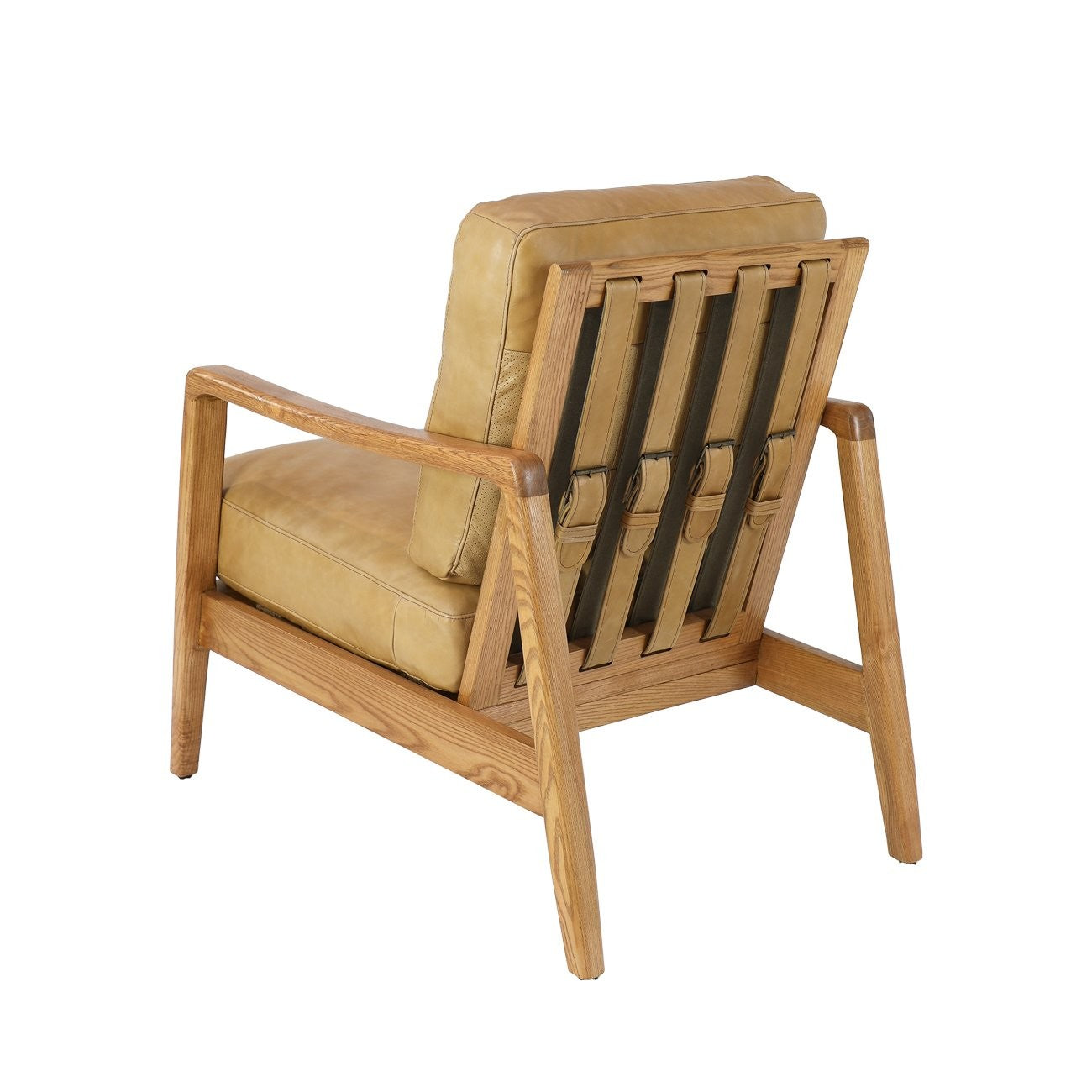 The Reid Armchair blends contemporary design with premium comfort, featuring hand-dyed leather, a sculptural strap backrest with brass buckle detail, and a supportive foam and feather cushion combination.