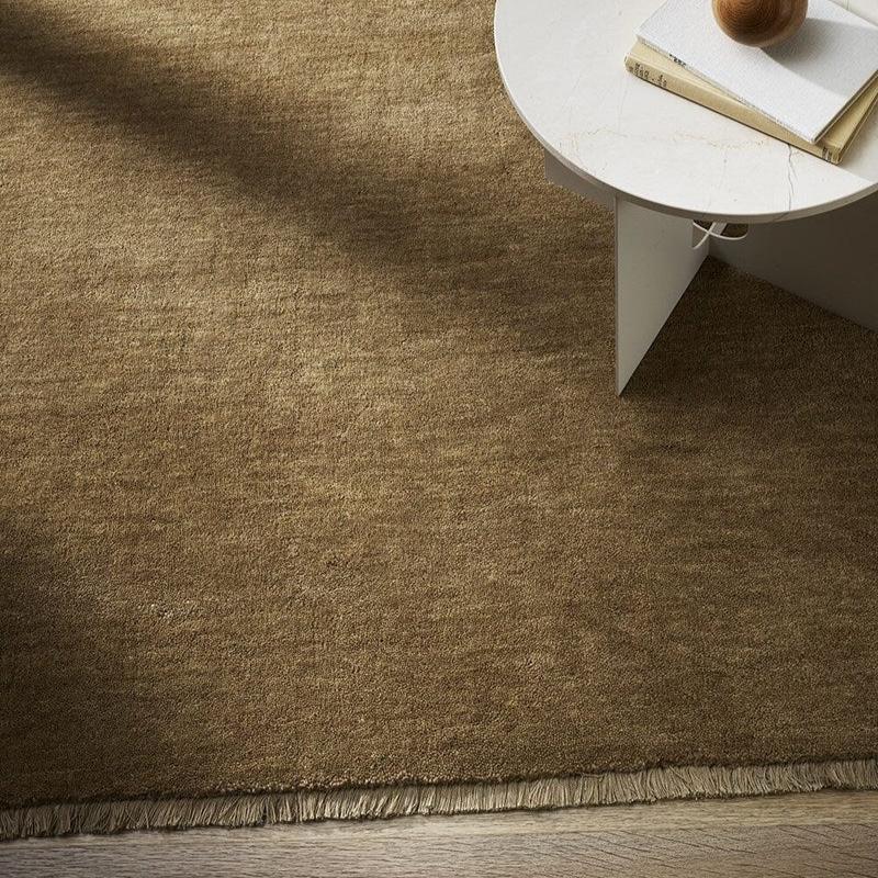 Sandringham Floor Rug by Baya in warm earthen tones with cut pile and fringing