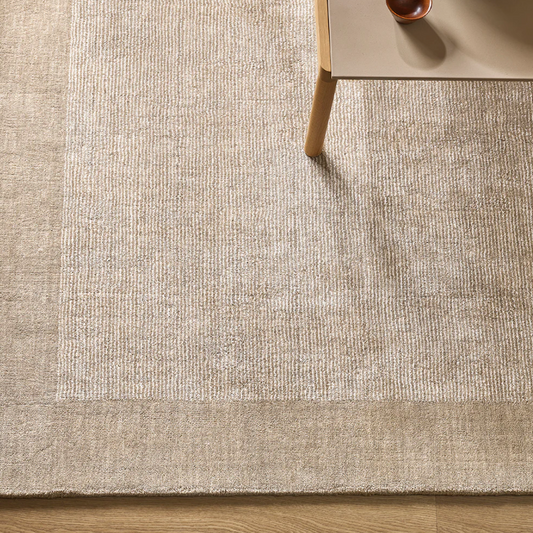 A refined wool and linen rug with subtle striping and a lustrous finish, designed to bring understated elegance to modern interiors.