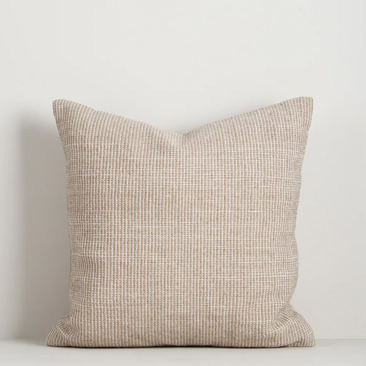 Shop the Baya Dune Outdoor Cushion at Comber and Comber. Handwoven from recycled PET with a textured two-tone design, perfect for stylish outdoor living.