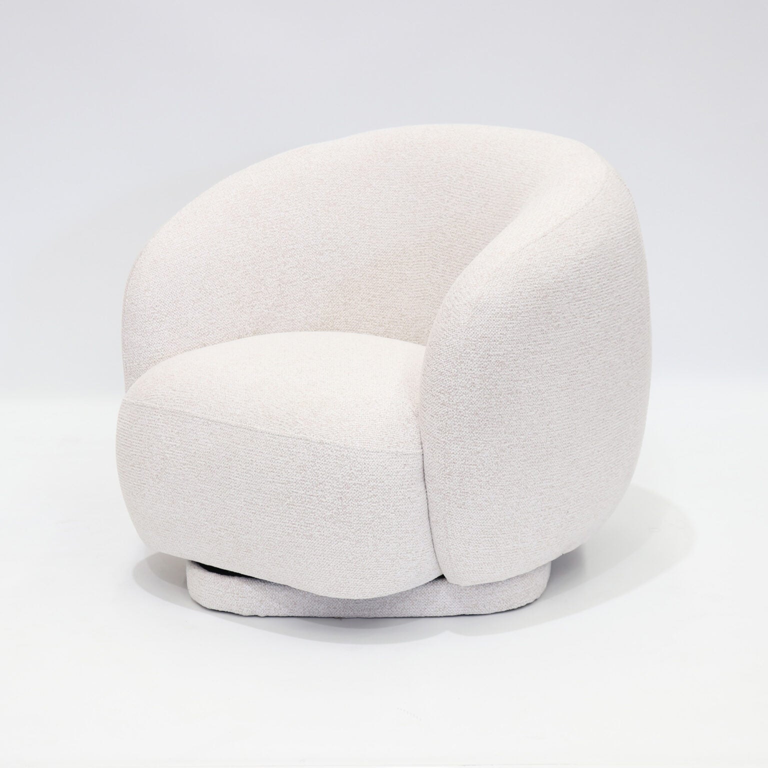 A soft, contemporary occasional chair in a warm cream tone, designed to bring comfort and understated elegance to any space.