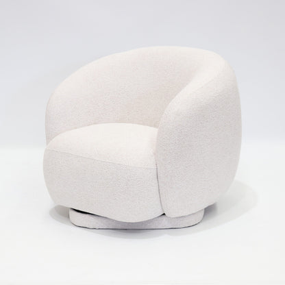 A soft, contemporary occasional chair in a warm cream tone, designed to bring comfort and understated elegance to any space.