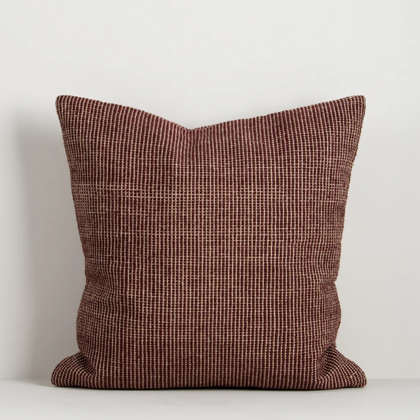 Shop the Baya Dune Outdoor Cushion at Comber and Comber. Handwoven from recycled PET with a textured two-tone design, perfect for stylish outdoor living.