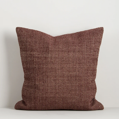 Shop the Baya Dune Outdoor Cushion at Comber and Comber. Handwoven from recycled PET with a textured two-tone design, perfect for stylish outdoor living.