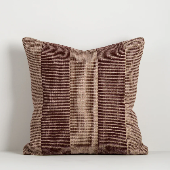 Shop the Baya Tide Outdoor Cushion at Comber and Comber. Handwoven from recycled PET with a textured linear design. Available in multiple colours.