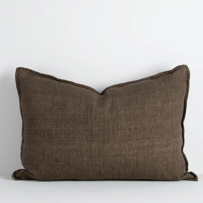 The Arcadia Cushion in warm mushroom linen is handwoven with a refined flange edge, offering timeless style and a relaxed contemporary feel.