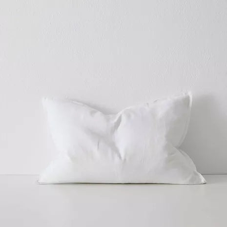 Stack of Como cushions styled on sofa in neutral tones – BLACK Concept Store