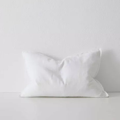 Stack of Como cushions styled on sofa in neutral tones – BLACK Concept Store