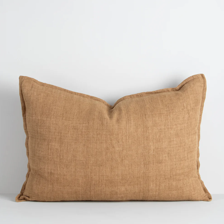 The Arcadia Cushion in warm mushroom linen is handwoven with a refined flange edge, offering timeless style and a relaxed contemporary feel.
