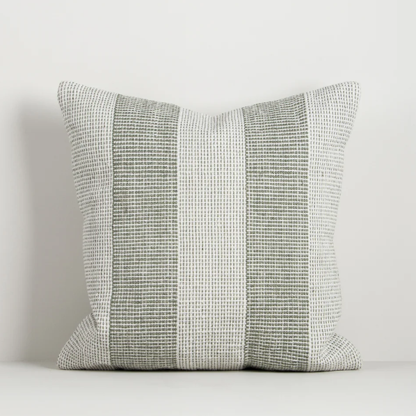 Shop the Baya Tide Outdoor Cushion at Comber and Comber. Handwoven from recycled PET with a textured linear design. Available in multiple colours.