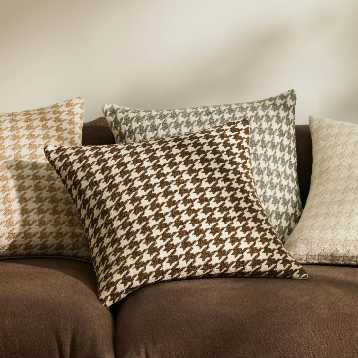 Shop the Giovanni 50x50cm cushion – a bouclé houndstooth design with geometric texture, perfect for layering or as a luxurious statement accent.