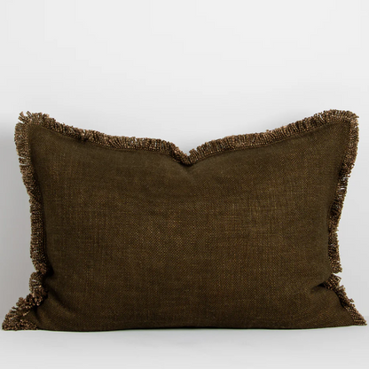 The Dover 40x60cm lumbar cushion features a thick woven texture in slate blue with soft fringing, adding warmth and understated style to any space.
