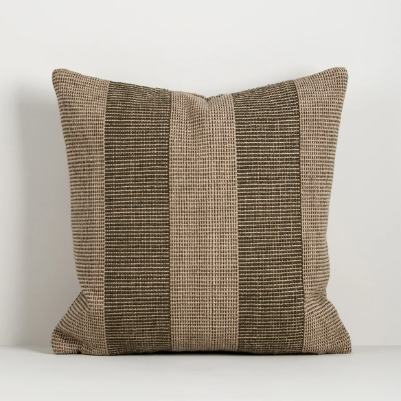 Shop the Baya Tide Outdoor Cushion at Comber and Comber. Handwoven from recycled PET with a textured linear design. Available in multiple colours.