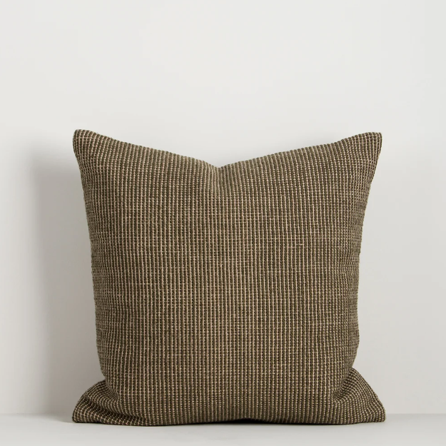 Shop the Baya Dune Outdoor Cushion at Comber and Comber. Handwoven from recycled PET with a textured two-tone design, perfect for stylish outdoor living.