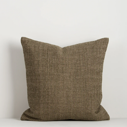 Shop the Baya Dune Outdoor Cushion at Comber and Comber. Handwoven from recycled PET with a textured two-tone design, perfect for stylish outdoor living.