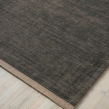 Discover the Remo Rug — 100% New Zealand wool with a high loop horizontal stripe design, cut border, and cotton backing. Available in 4 colours, ideal for contemporary living.