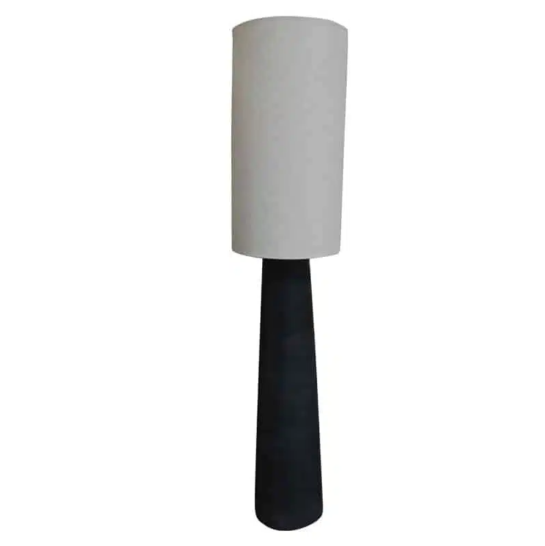 Tall lamp with a white cylindrical shade and black base on a white background