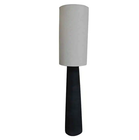 Tall lamp with a white cylindrical shade and black base on a white background