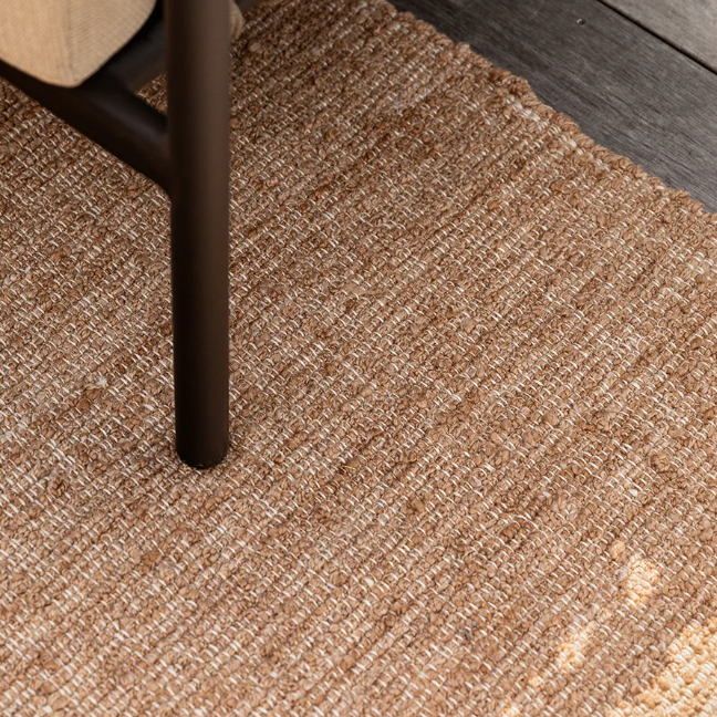 Shop the Baya Ormond Outdoor Rug at Comber and Comber. A handwoven recycled PET rug with a soft bouclé texture. Available in Biscotti and Mineral.