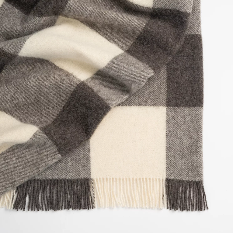 Shop the Lake Hayes wool throw 140x240cm – a soft, 100% New Zealand wool throw with a classic brown-and-cream check design, cosy warmth, and elegant gift-ready presentation.
