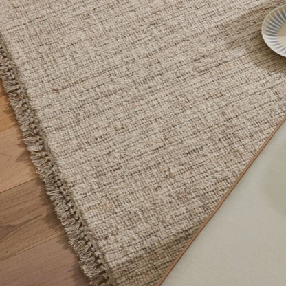 Close-up of plush pile and fringe on Puglia Fossil rug – BLACK Concept Store