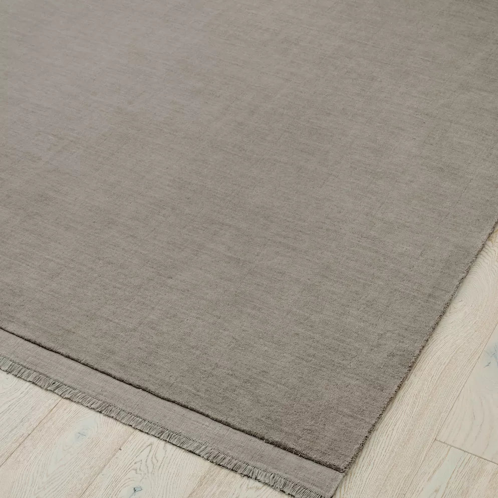 Light grey rug on a light wood floor. 2x3m 3x4m. 100% NZ wool