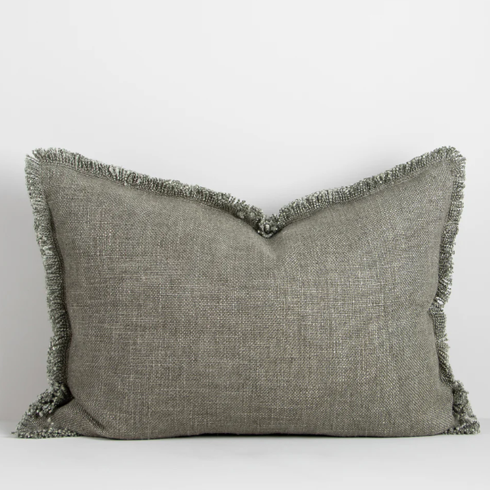 The Dover 40x60cm lumbar cushion features a thick woven texture in slate blue with soft fringing, adding warmth and understated style to any space.