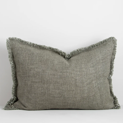The Dover 40x60cm lumbar cushion features a thick woven texture in slate blue with soft fringing, adding warmth and understated style to any space.