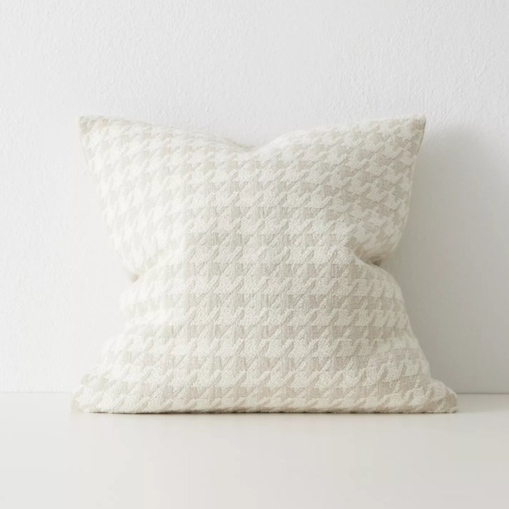 Shop the Giovanni 50x50cm cushion – a bouclé houndstooth design with geometric texture, perfect for layering or as a luxurious statement accent.