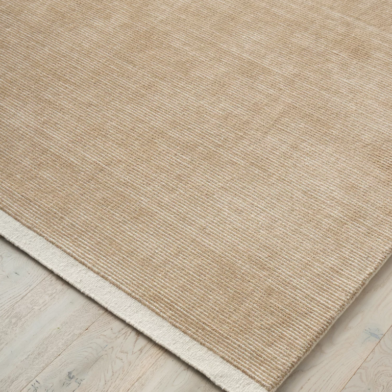 Discover the Remo Rug — 100% New Zealand wool with a high loop horizontal stripe design, cut border, and cotton backing. Available in 4 colours, ideal for contemporary living.