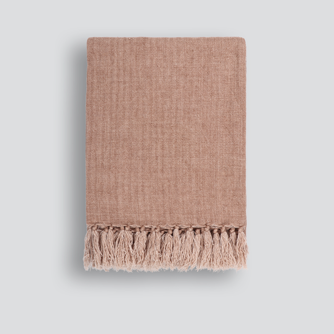 Millhouse Throw styled on a sofa with tassel detailing – BLACK Concept Store