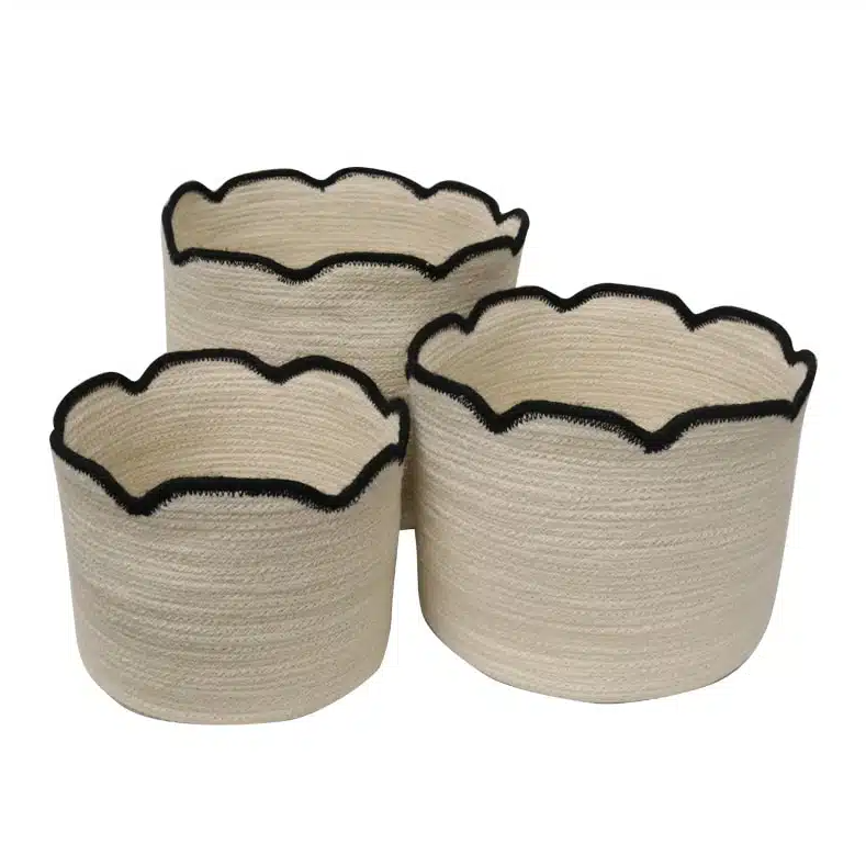 Three beige woven baskets with black rim 